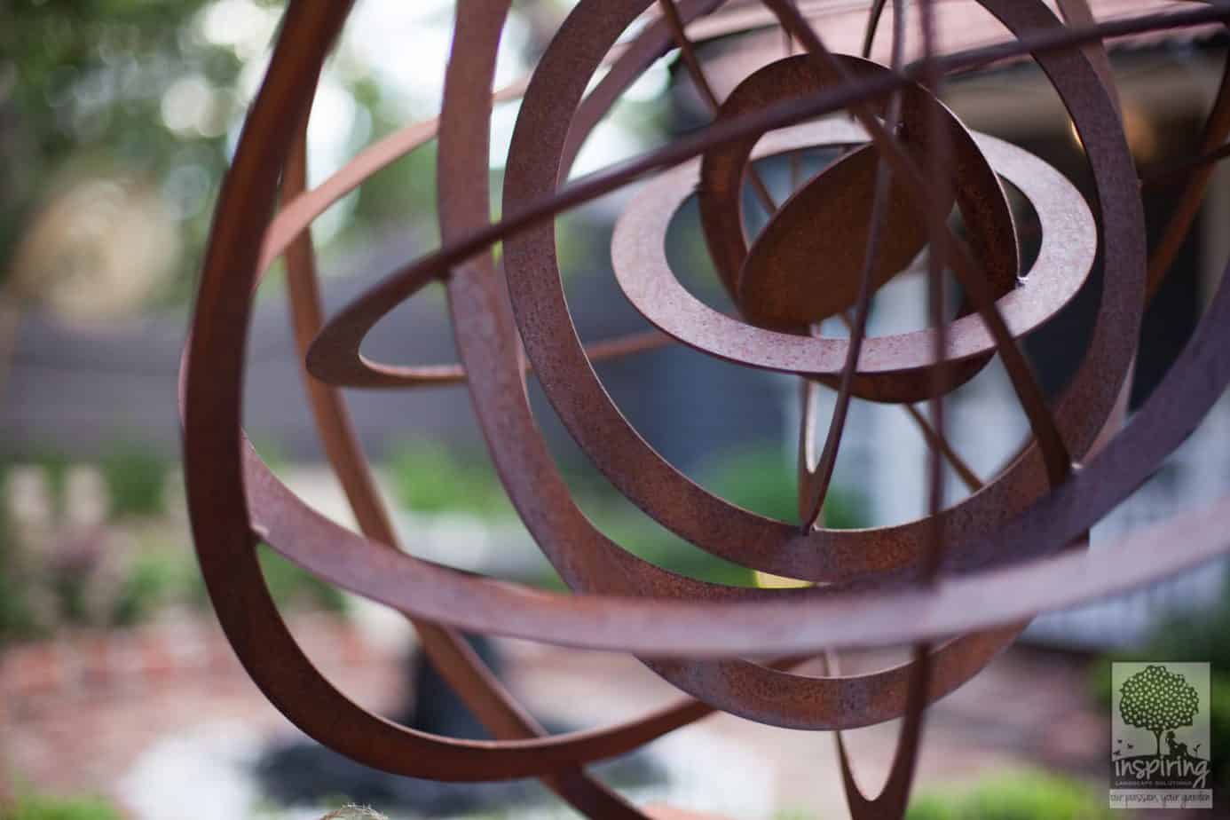 Corten spherical ring garden sculpture in Blackburn landscape design