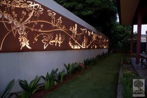 Large metal garden feature used in Glen Waverley garden design lit at night