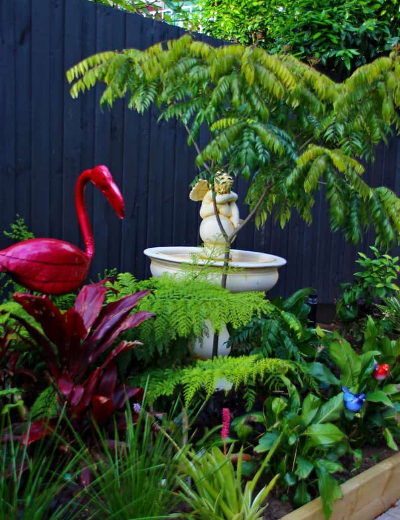 Red flamingo garden sculpture used in Vermont South garden design