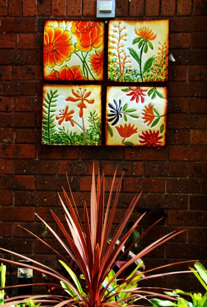 Close up of metal artwork used in tropical garden design in Vermont South