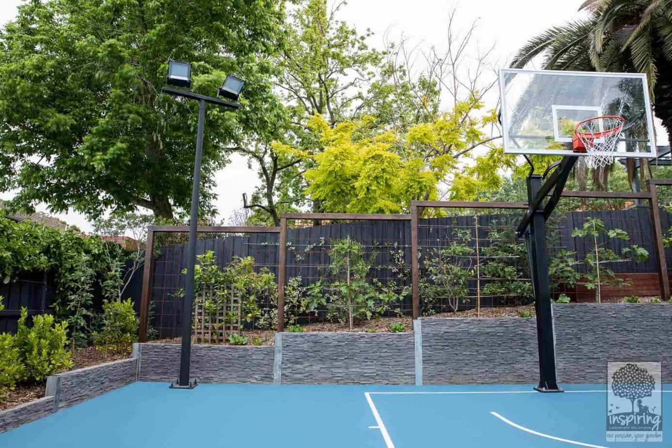 Edible garden design with a mini fruit orchard and vege patch in the backyard of a Camberwell property in Melbourne