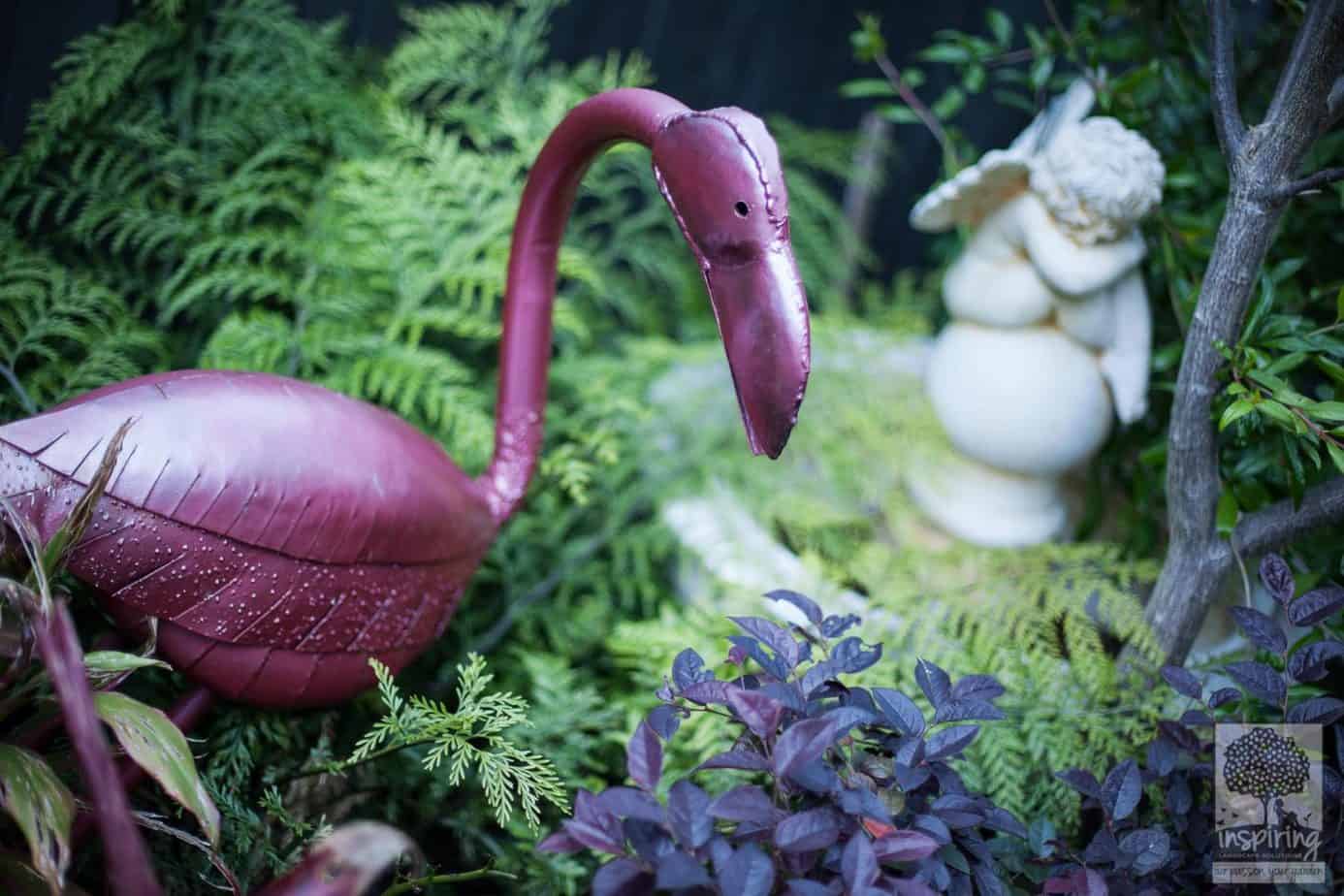 Close up of tropical garden design in Vermont South landscape design with metal flamingo