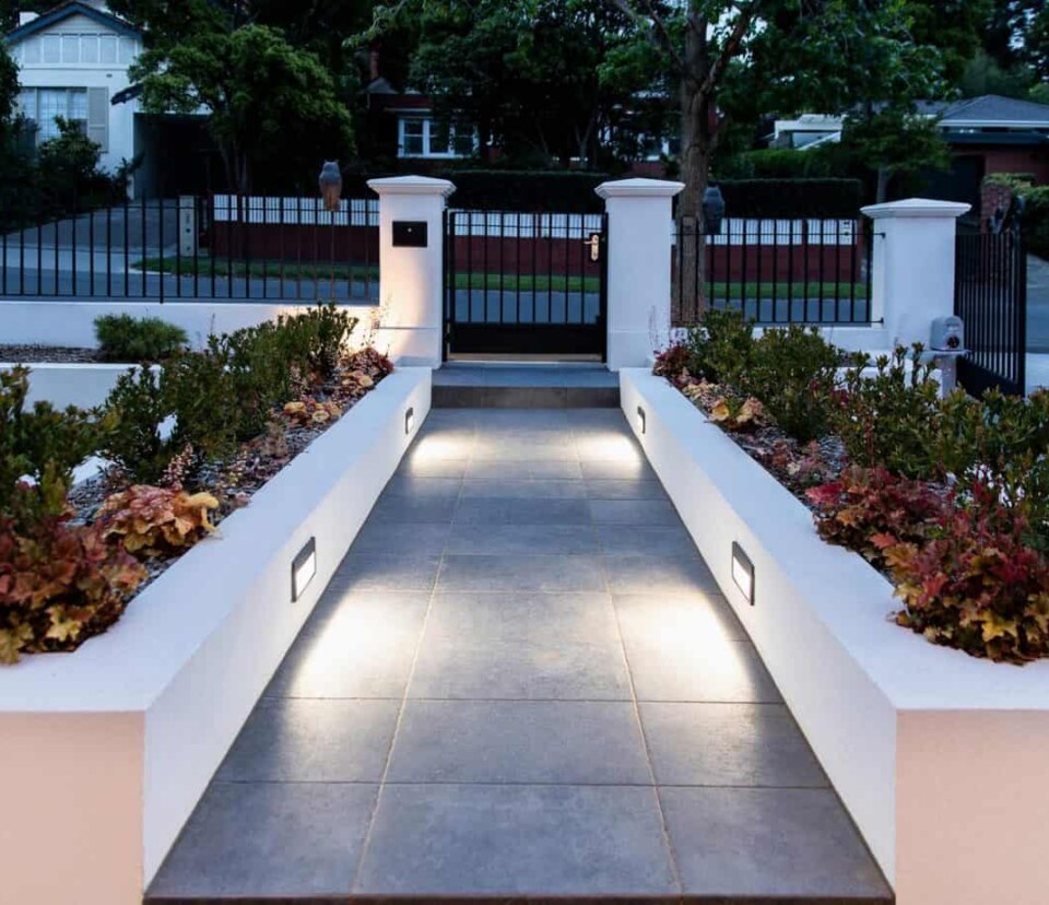 Front entrance garden beds of a new build in Camberwell lit up at night