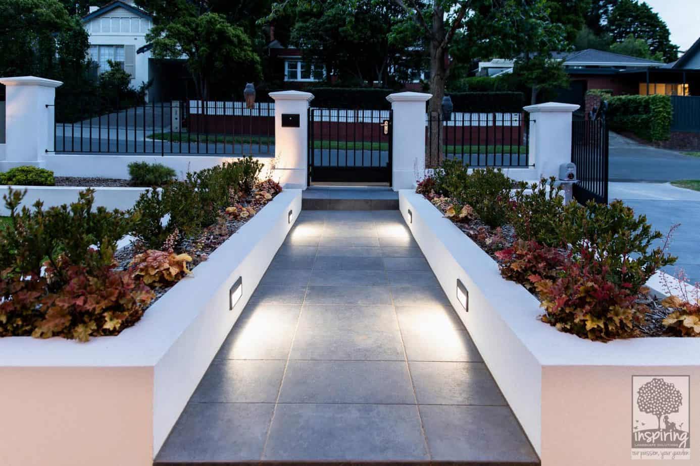 Front entrance garden beds of a new build in Camberwell lit up at night