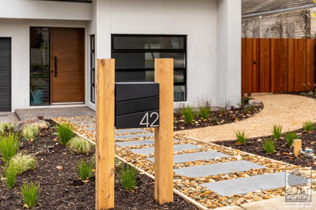 View of front entry stepper path from the street in Burwood landscape design by Parveen Dhaliwa