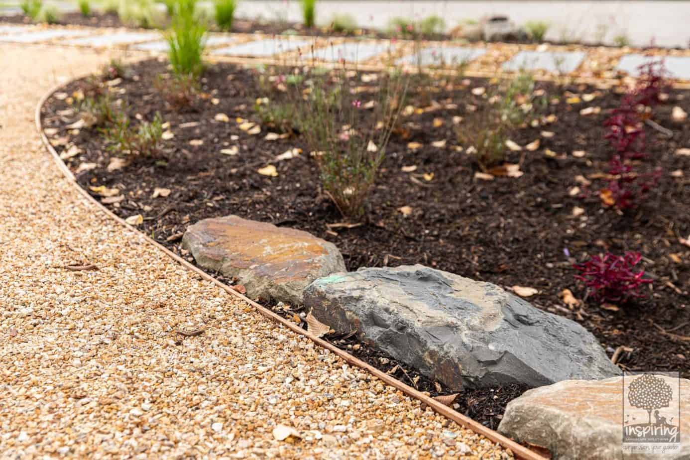 Garden bed, rocks and gravel path in Burwood garden design by Inspiring Landscape Solutions