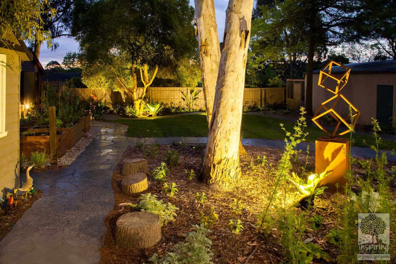 View of Blackburn backyard garden lit up at night