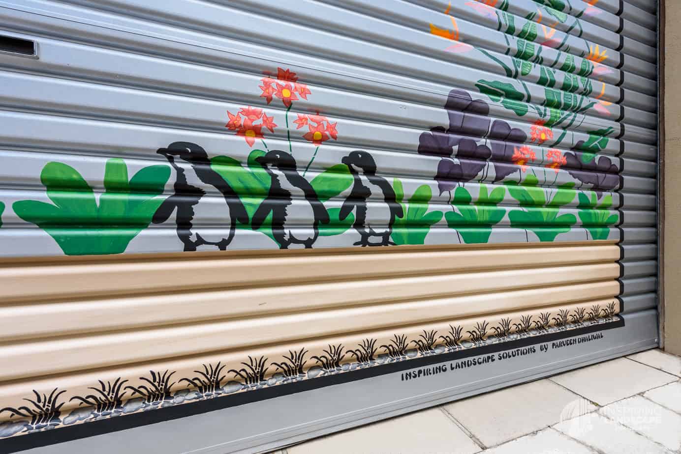 Penguin and bird of paradise mural in Hawthorn garden design by Inspiring Landscape Solutions