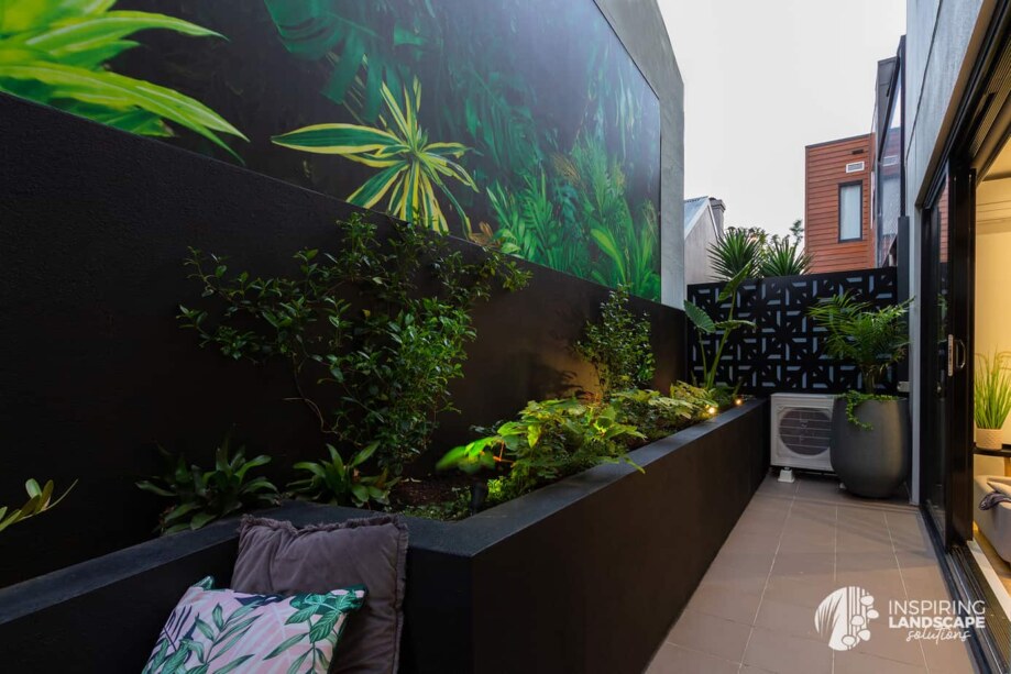 Tropical garden design in Richmond courtyard with feature mural