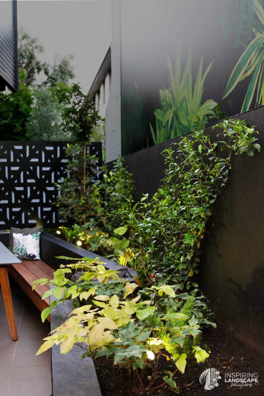 Tropical garden design in Richmond with large feature mural